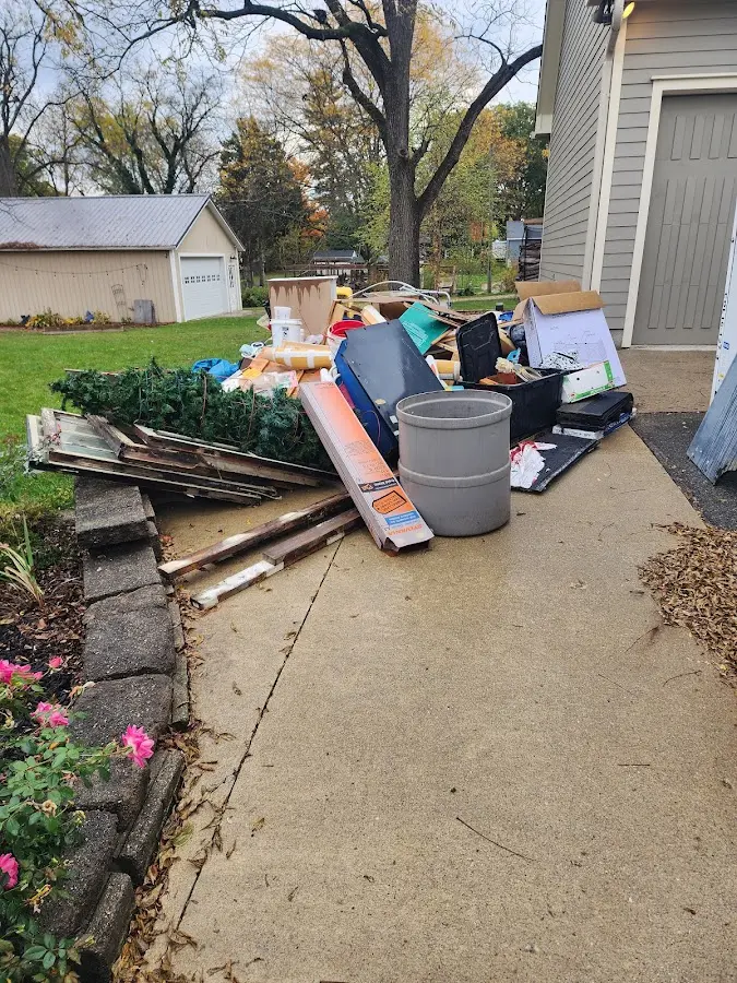 Dumpster being loaded with debris for 30 Yard Dumpster Rental in Weddington